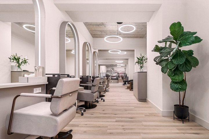 INIZIO salon interior with arched alcoves and natural light